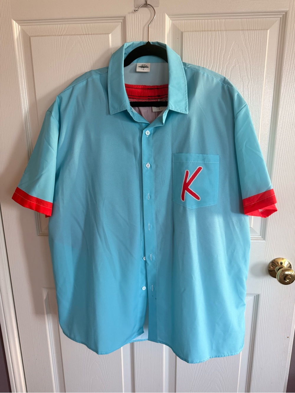 Men’s XL Ken costume with Lightblue shirt with red trim and red shorts